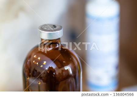 Gelatin capsule container devoid of contents amid hazy laboratory atmosphere and condensation Gelatin capsule container devoid of contents amid hazy laboratory atmosphere and condensation 136804566