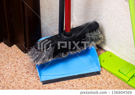 Homeowner organizing cleaning essentials as part of routine household tidying activities Homeowner organizing cleaning essentials as part of routine household tidying activities 136804569