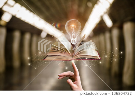 Ideas flow from an open book 136804722
