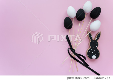 Black and white wood rabbit and eggs bouquet for easter celebration on the pink background. Shopping of Easter holidays. Space for text. 136804743