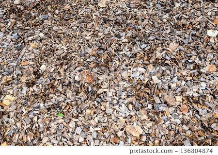 Yellow wood chips background. Playground natural flor. Decoration for exterior. Yellow wood chips background. Playground natural flor. Decoration for exterior. 136804874