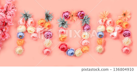 Abstract flower composition, spring background. Words mom from flowers on pink background, minimal holiday concept. Women's day or mother's day card, happy birthday, wedding, screen banner, Abstract flower composition, spring background. Words mom from flowers on pink background, minimal holiday concept. Women's day or mother's day card, happy birthday, wedding, screen banner, 136804910