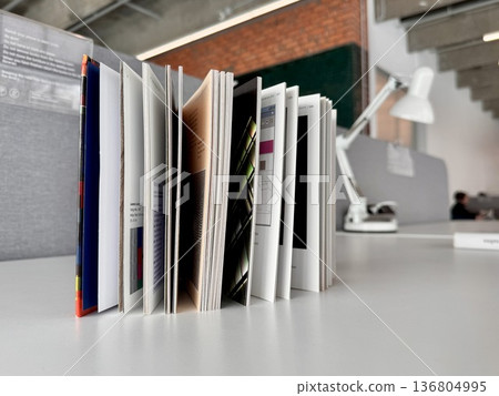 an open book standing on a table on a light background an open book standing on a table on a light background 136804995