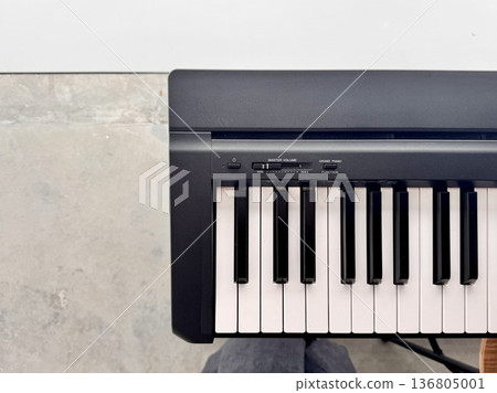 A stylish modern synthesizer for musicians is located indoors 136805001