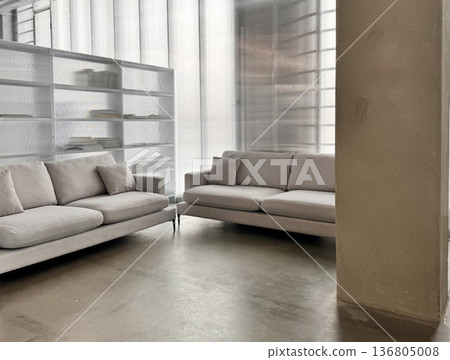 a modern leather sofa in a pastel beige shade in a stylish interior a modern leather sofa in a pastel beige shade in a stylish interior 136805008
