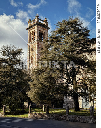 Ancient Tower Amidst Nature. Sunkissed Bell Chamber Overlooking Lush Park Ancient Tower Amidst Nature. Sunkissed Bell Chamber Overlooking Lush Park 136805039