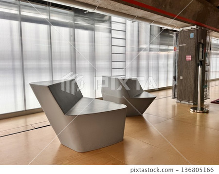 stylish modern designer chairs in the interior in beige warm shades stylish modern designer chairs in the interior in beige warm shades 136805166