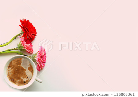 Floral arrangement with gerbera flowers and a cup of coffee. Concept for Valentine's Day or Women's Day, Mother's Day, banner, greetings to your loved one on holiday, birthday, minimal modern design, Floral arrangement with gerbera flowers and a cup of coffee. Concept for Valentine's Day or Women's Day, Mother's Day, banner, greetings to your loved one on holiday, birthday, minimal modern design, 136805361