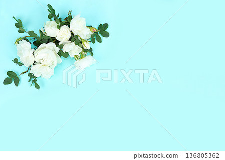 Beautiful roses on a light background with space for text.Abstract floral composition, hello spring concept, template for design, still life with flowers for holiday, selective focus. Beautiful roses on a light background with space for text.Abstract floral composition, hello spring concept, template for design, still life with flowers for holiday, selective focus. 136805362