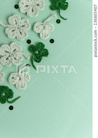 Crocheted Four Leaf Clovers with Sequins.  Saint Patricks Day Decorative Background 136805407