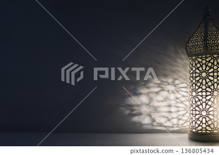 Ramadan lantern casting intricate islamic pattern shadows Ramadan lantern casting intricate islamic pattern shadows 136805434