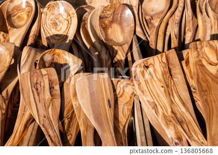 A lot of wood spoons on the market. Handmade tableware for sell. A lot of wood spoons on the market. Handmade tableware for sell. 136805668