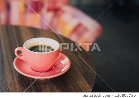Cup of black coffee on a table in a cafe. 136805750