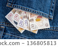 Jeans with british pound money. United Kindom bills in the pants pocket for commerce concept. 136805813