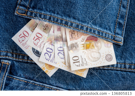 Jeans with british pound money. United Kindom bills in the pants pocket for commerce concept. 136805813