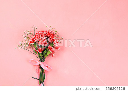 Floral arrangement with carnations on a pink background. Concept for Valentine's Day or Women's Day, Mother's Day, banner, greeting your loved one on holiday, birthday, minimal modern design, 136806126
