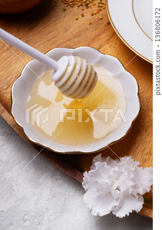 linden honey with perga at wooden tray on white table.  top view. close up 136806172