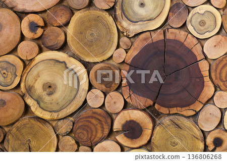 Round wooden unpainted solid natural ecological soft colored brown and yellow stumps background, Tree cut sections different sizes for pad mat background texture. Do It Yourself art concept. 136806268