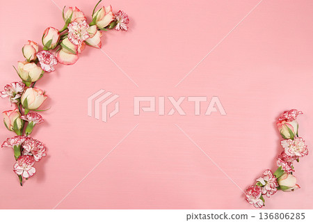 Arrangement of flowers on a pink isolated background, place for text, flat lay. Creative modern bouquet, minimal holiday and spring concept. Greeting card for Women's Day or Valentine's Day, happy 136806285
