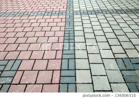 Stone pavement in perspective. Granite cobblestone pavement tiles. 136806318