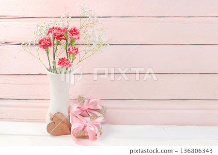 Abstract floral composition, spring background. Carnations in a vase, Creative modern bouquet, minimal holiday concept. Postcard for womens day or mothers day, happy birthday, wedding, banner for the Abstract floral composition, spring background. Carnations in a vase, Creative modern bouquet, minimal holiday concept. Postcard for womens day or mothers day, happy birthday, wedding, banner for the 136806343