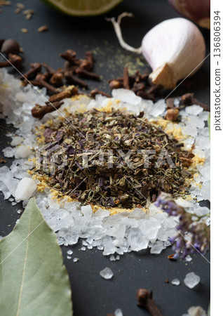 seasonings background with salt, Spices and garlic served at black. Colorful natural meal additives. healthy food concept. macro shot seasonings background with salt, Spices and garlic served at black. Colorful natural meal additives. healthy food concept. macro shot 136806394