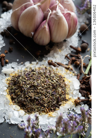 seasonings background with salt, Spices  and garlic served  at black. natural meal additives. healthy food concept. macro shot 136806402