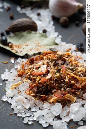 seasonings background with salt, Spices  served  at black. natural meal additives. healthy food concept.  extreme macro shot 136806407