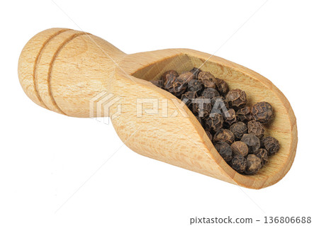 Black peppercorns or pepper in a wooden bowl isolated on a white background Black peppercorns or pepper in a wooden bowl isolated on a white background 136806688