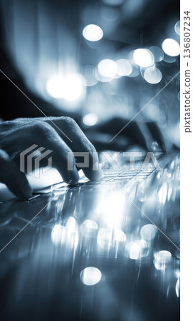 Remote team building activity shown with hands typing on keyboard, digital workspace, modern technology, and creative collaboration in professional environment with blue lighting 136807234