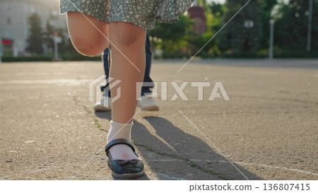 Kid child baby boy girl happy family, child dream, Action shot of hopscotch, chalk square classic game, two kids hopping, motion upward, snapshot of play, education through games, sunny learning fun 136807415