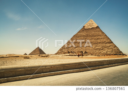 Ancient Stone Pyramids of Giza Surrounded by Endless Sand Ancient Stone Pyramids of Giza Surrounded by Endless Sand 136807561