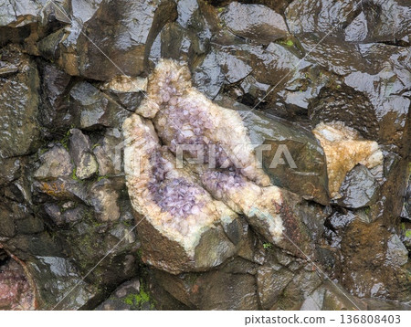 Misiones, Argentina - June 23, 2025: Minera Vanda or the Vanda Mines in Misiones, Argentina. An amethyst geode in a basalt wall. Misiones, Argentina - June 23, 2025: Minera Vanda or the Vanda Mines in Misiones, Argentina. An amethyst geode in a basalt wall. 136808403