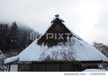 Thatched roof in winter Thatched roof in winter 136808594