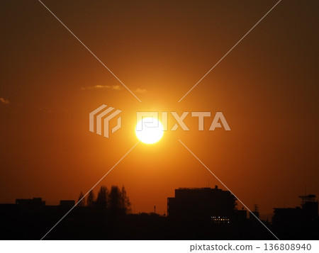 The sun setting in the city The sun setting in the city 136808940