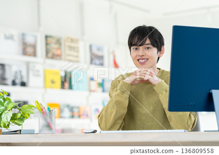 Young designer working in the office 136809558