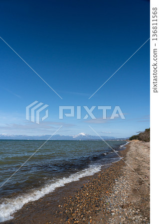 Lake Biwa in midwinter and the snowy mountains of Kohoku in the distance 136811568