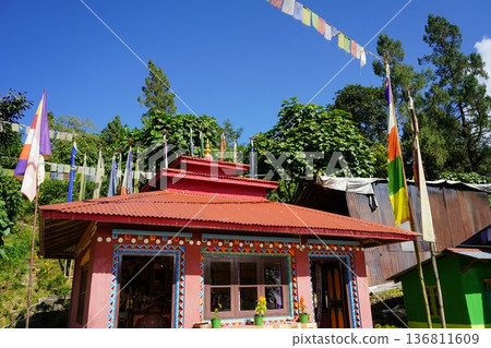 Small Tibetan Buddhist Shrine with Prayer Flags under Clear Blue Sky Small Tibetan Buddhist Shrine with Prayer Flags under Clear Blue Sky 136811609