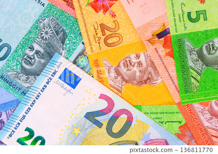 Malaysian ringgit banknotes, Euro cash are together on European cash for identification use. Malaysian ringgit banknotes, Euro cash are together on European cash for identification use. 136811770