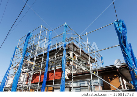 House with scaffolding House with scaffolding 136812758