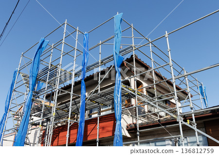 House with scaffolding House with scaffolding 136812759