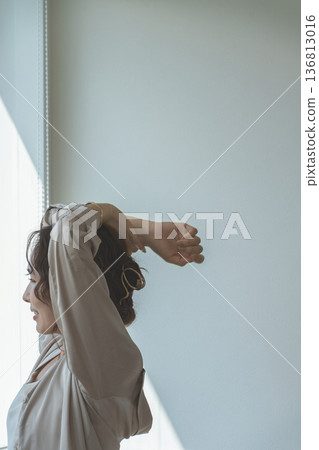 A woman by the window in the setting sun (model, fashion, light, shadow) A woman by the window in the setting sun (model, fashion, light, shadow) 136813016