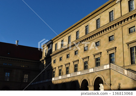 A classic European building with a beautiful blue sky and shadows A classic European building with a beautiful blue sky and shadows 136813068