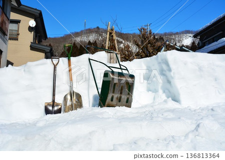 Snow removal in spring in a heavy snow area Snow removal in spring in a heavy snow area 136813364