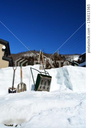 Snow removal in spring in a heavy snow area Snow removal in spring in a heavy snow area 136813365