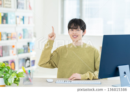 Young male designer working in the office Young male designer working in the office 136815386