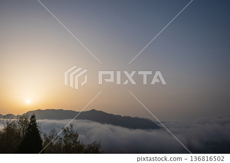 Mountains floating in a sea of clouds in the morning Mountains floating in a sea of clouds in the morning 136816502