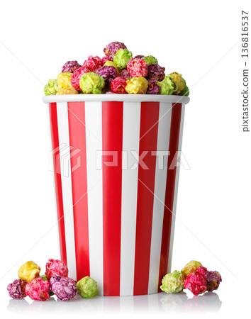 Caramelized fruit popcorn in red and white striped paper cup isolated on white Caramelized fruit popcorn in red and white striped paper cup isolated on white 136816537