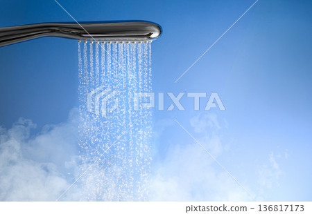 Shower head and water stream in blue bathroom Shower head and water stream in blue bathroom 136817173