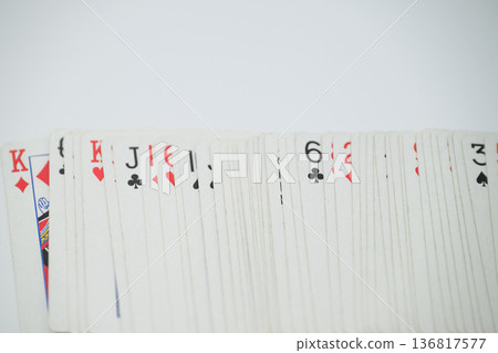 Playing cards spread out on a white background Playing cards spread out on a white background 136817577